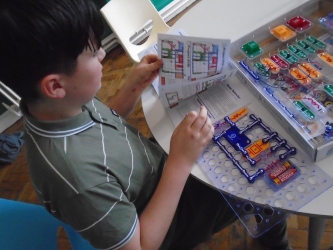 An autistic child learning at Forest School at Quorn Hall School